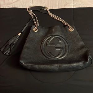 Women’s black Gucci bag